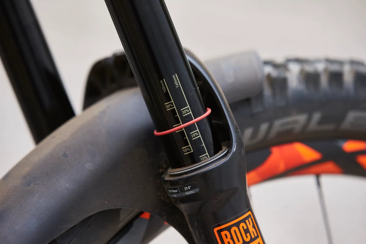 Most forks and shocks have rubber o-rings and handy dials on the stanchions for setting sag. Photo: Steve Behr