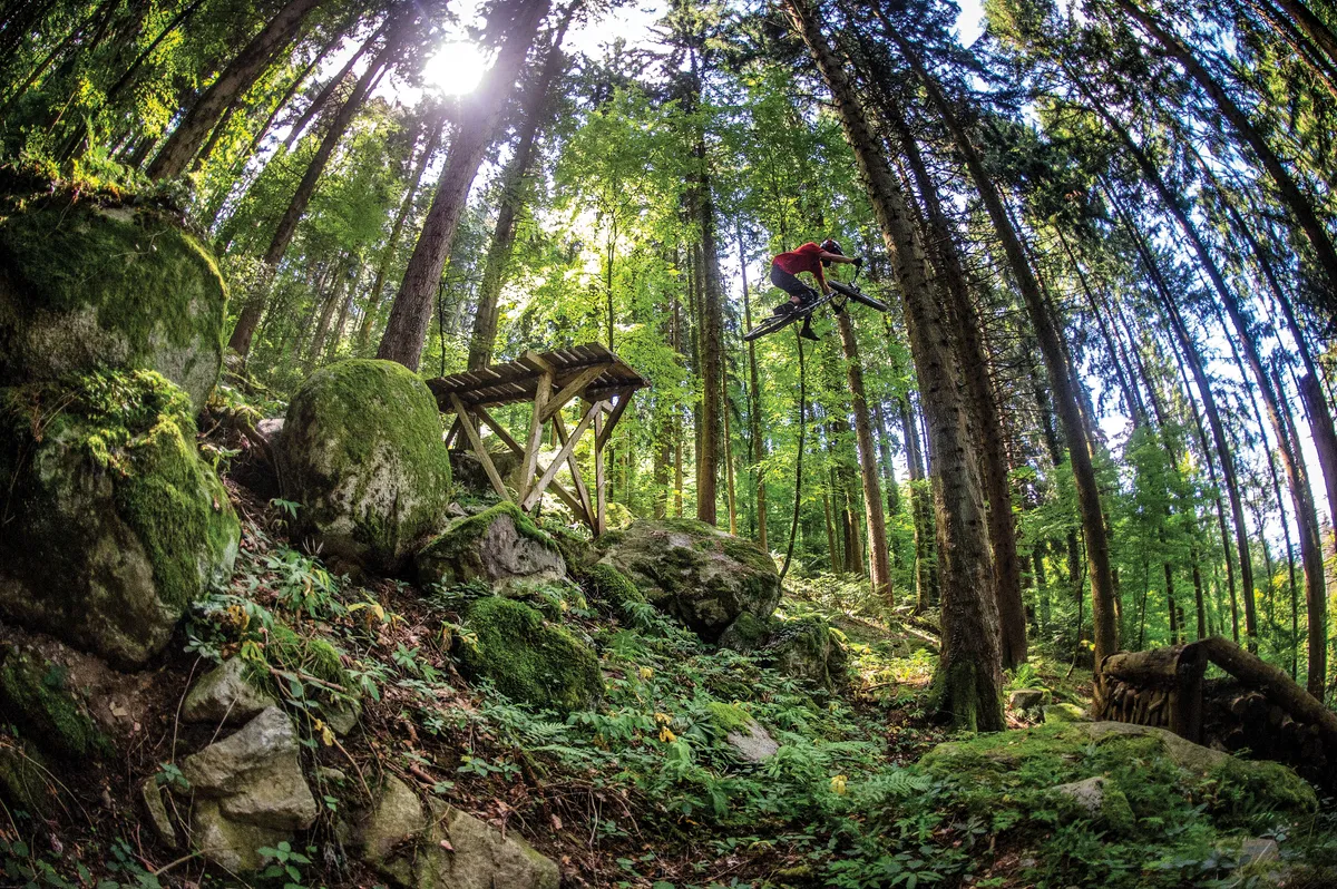 Vinny T sends it off one of the crazy features at his local trails near Evian