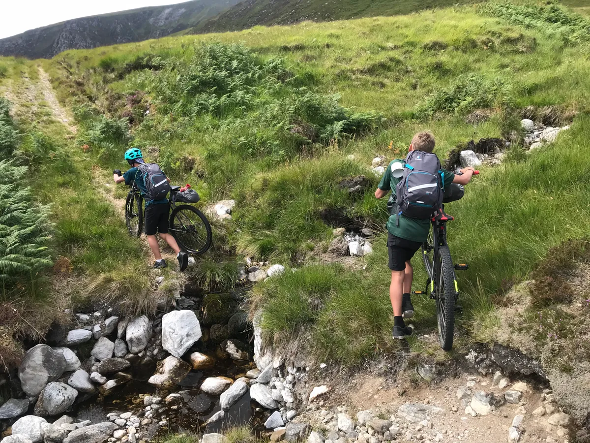 Trekking up the side of Loch Choire on increasingly rubbly tracks in the Northern Highlands (day 2)
