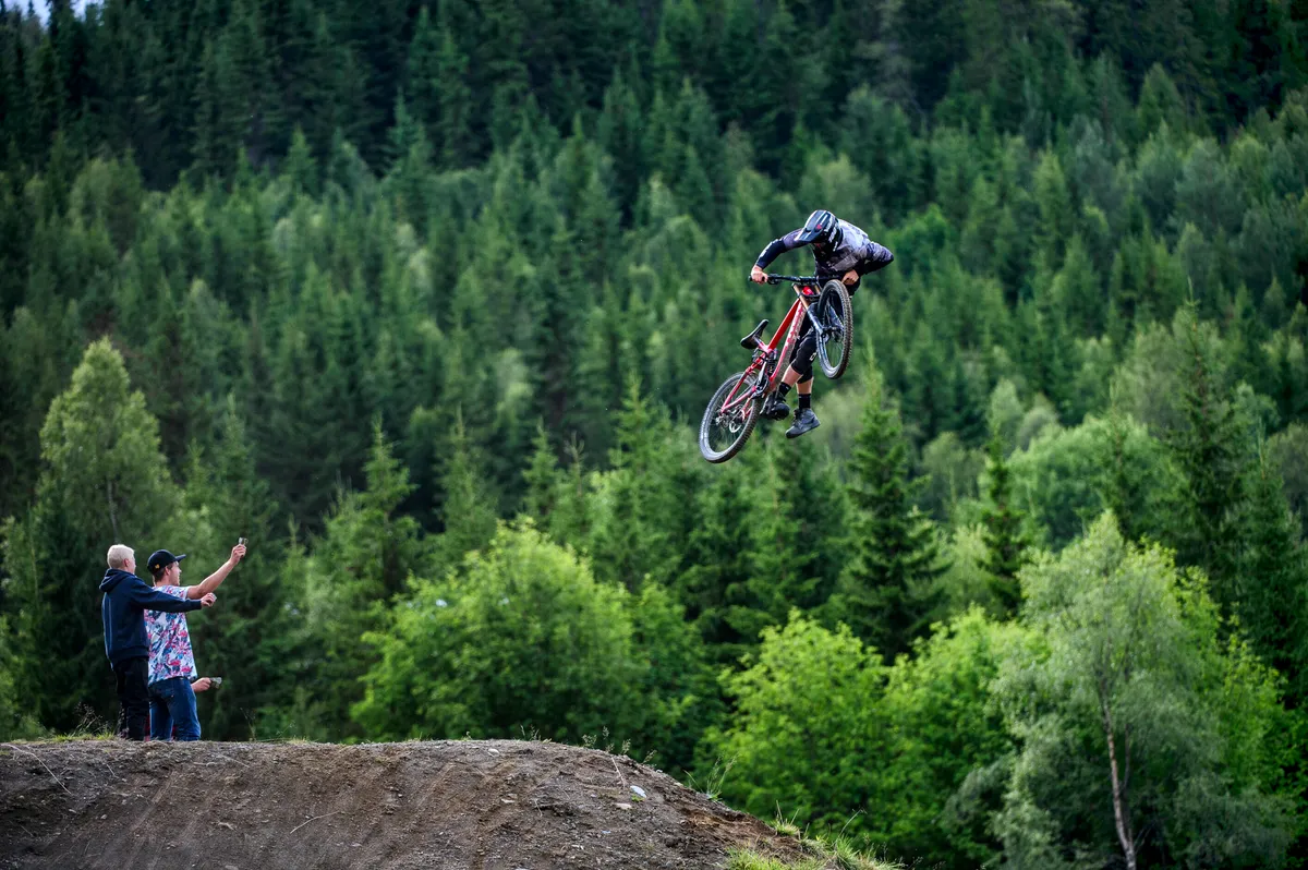Previous Rampage competitor Ramon Hunziker slings a leg off over the big hip. Photo: Andy Lloyd