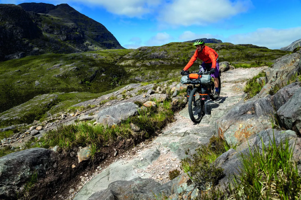The steep slabs of Torridon are a challenge, never mind with a fully-laden bike