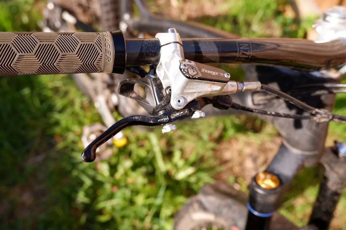 The Tech3 lever from Hope gives reach and bite point adjustment and the reservoir caps are custom etched with the 'HB' graphic on this bike.