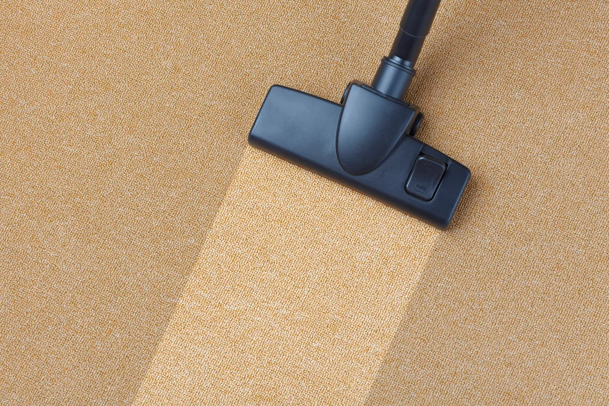 Vacuuming carpet