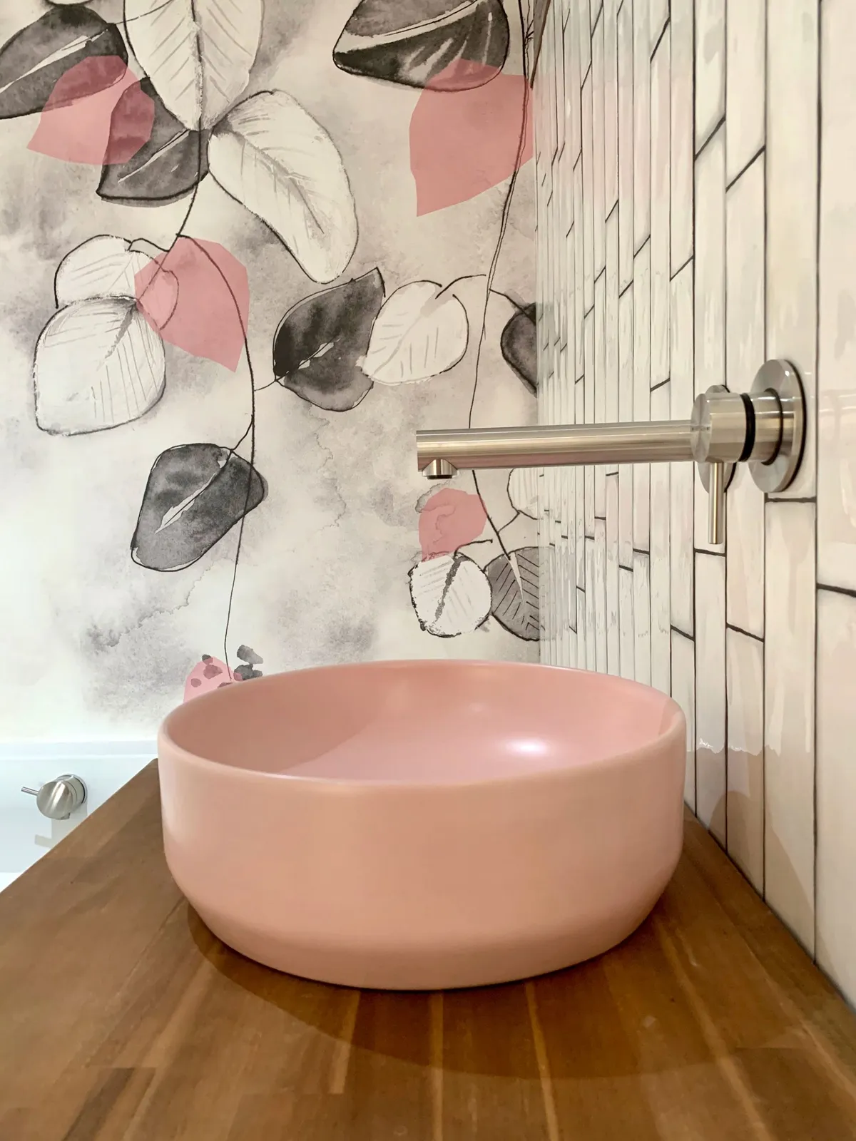 Pink wallpaper and sink