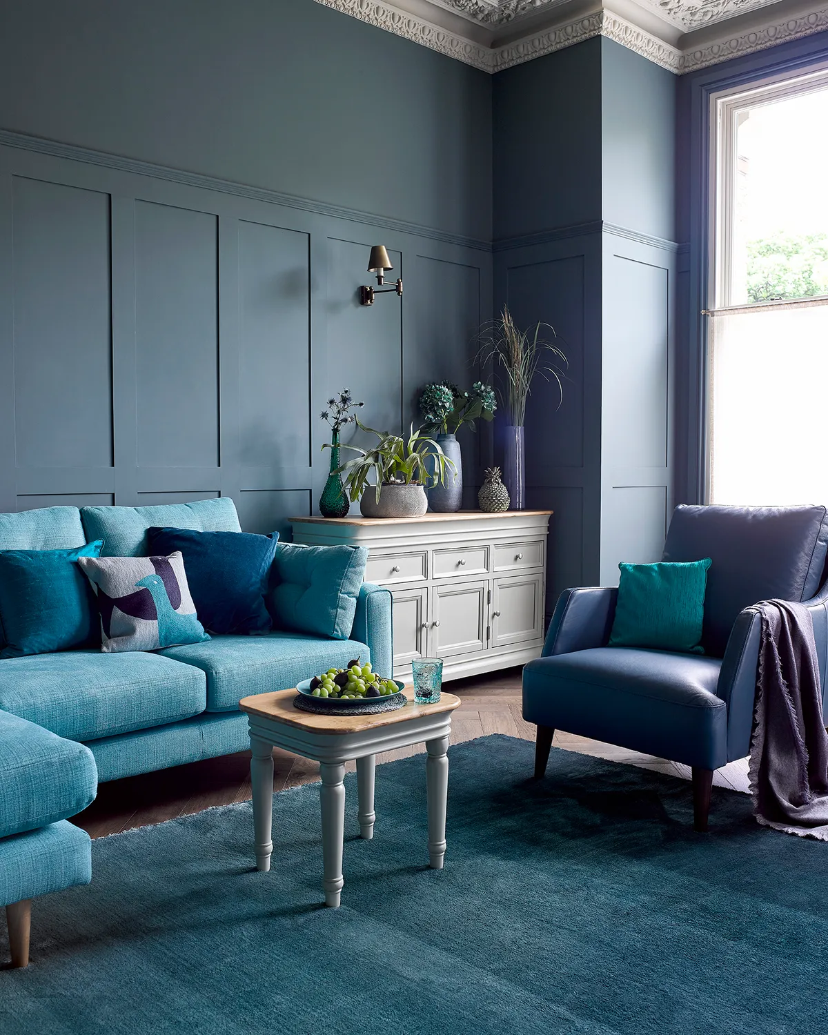 Don't just stick to one tone - combine bright azure with cerulean and aegean blue to keep traditional furnishings interesting. Image by Oak Furnitureland. 