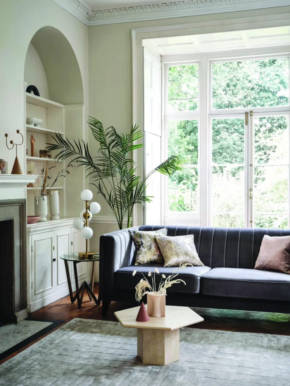 This sophisticated trend focuses on shapes rather than colours, so you can keep your scheme light and neutral, and let your décor take centre stage Fluted Ivy two-seater in Velluto Anthracite/Grey mix, £899; Mia blush scatter cushion, £35; Moonstruck scatter cushion, £35; Kingsley large rug, £399; Angle side table, £379, all Sofology