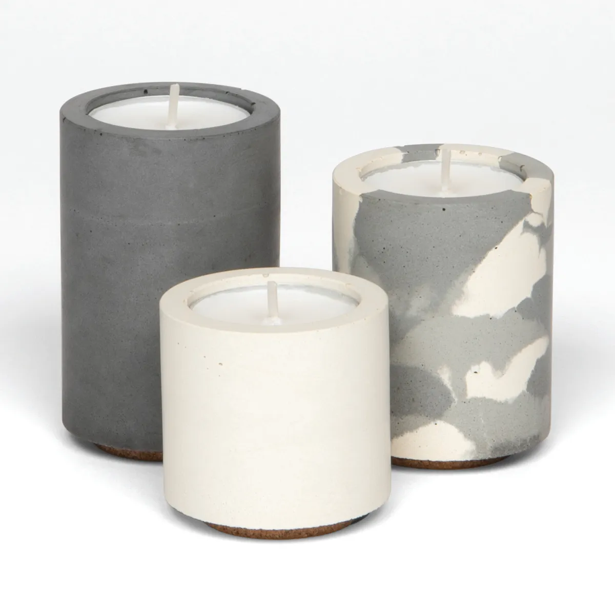 Try the industrial trend with textured concrete holders. Tealight trio, £35, Concrete & Wax