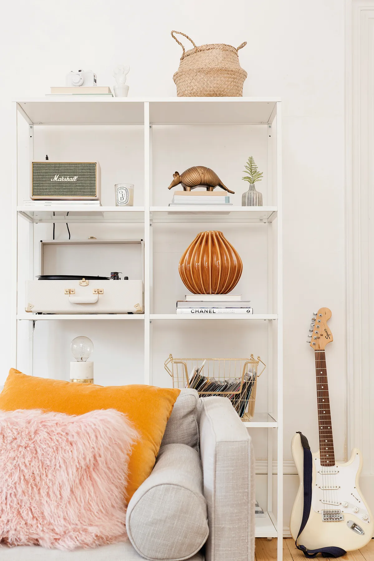 Kate has displayed a variety of accessories, including a vintage record player from Urban Outfitters, on this open shelving unit