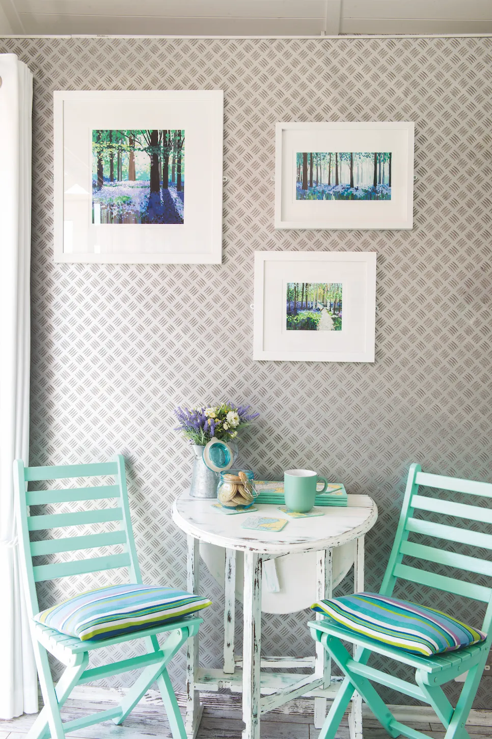 Real home - silver textured wallpaper and turquoise folding chairs