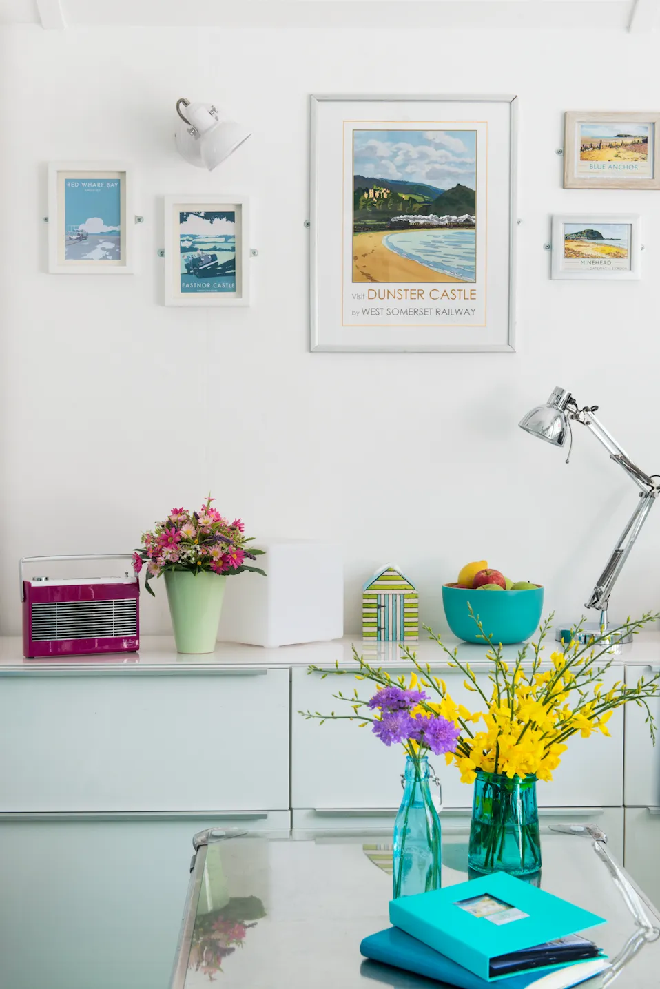 Real home -seaside themed prints on a white wall