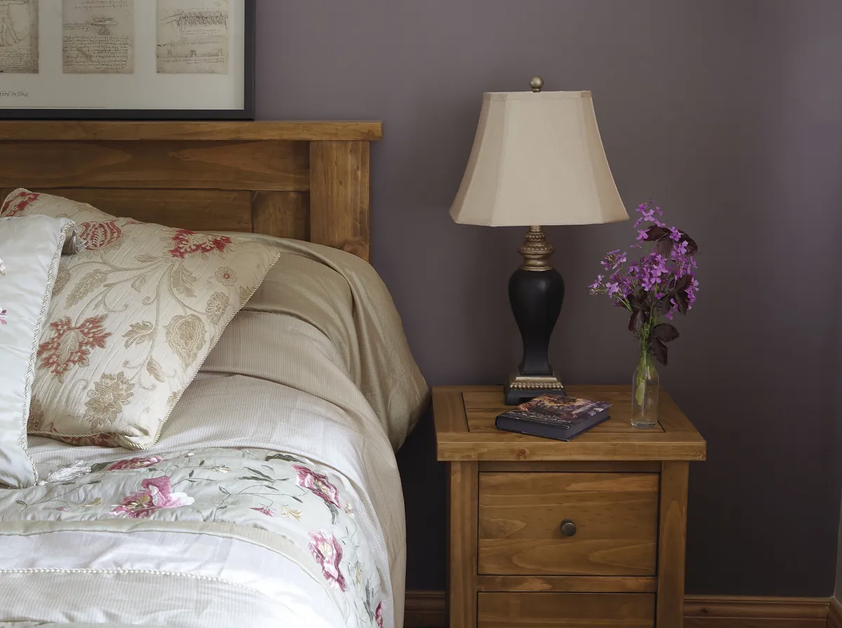 Elaine has gone for a comfortable, country look in the guest bedroom. The bed and bedside tables are from Harvey Norman, the bedside lamps came from Dunnes Stores. The picture over the bed is from IKEA and the duvet set was a gift