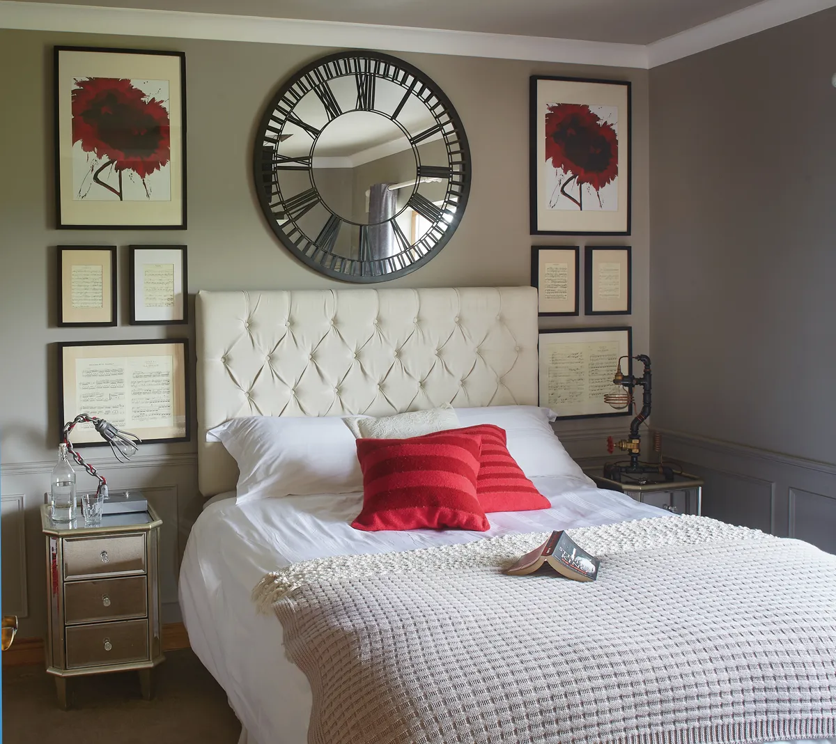 In the master bedroom, Shane made the bedside lamps and framed musical score around the bed. The mirror and the mirrored lockers are from Next, the walls are painted in Taupe from Colourtrend and the couple had the headboard made. The red cushions are from Avoca