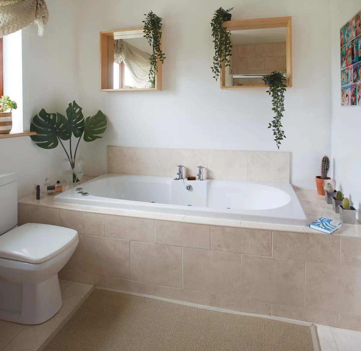The basic bathroom is slated for refurbishment, but Elaine has cheered it up with mirrors and faux trailing plants from IKEA and an art print from TK Maxx. The faux cheese plant leaves are also from IKEA and the tiles are from Armatile