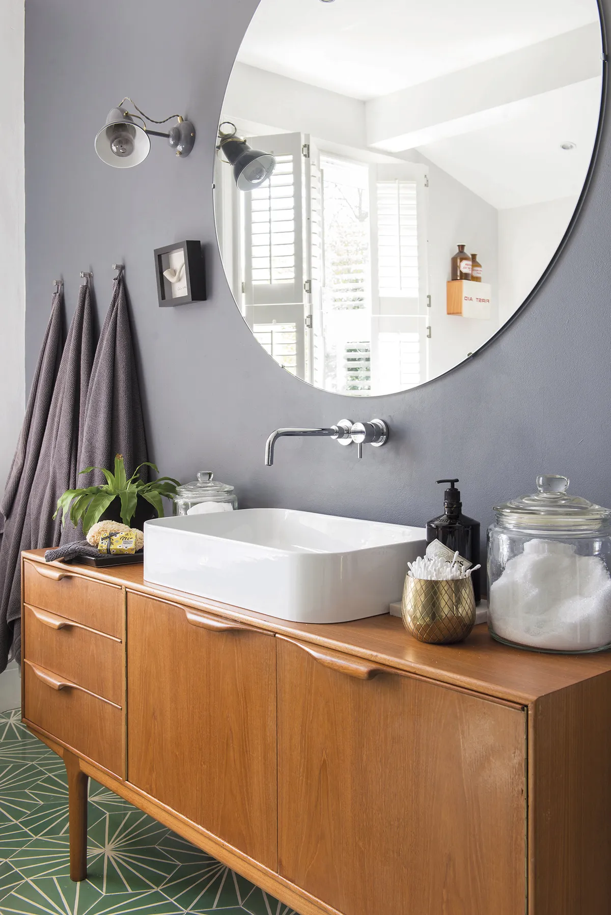 A large mirror from Leeds Glass helps to reflect light back into the space
