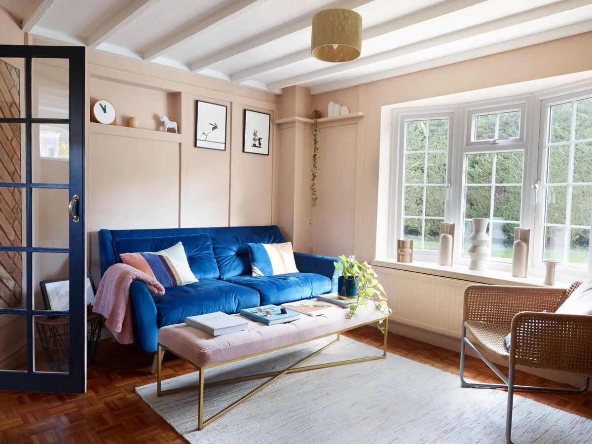 The blue velvet sofa from Dunelm provides a striking contrast to the pink scheme, while the velvet Julianne bench from Made.com is a quirky alternative to a coffee table