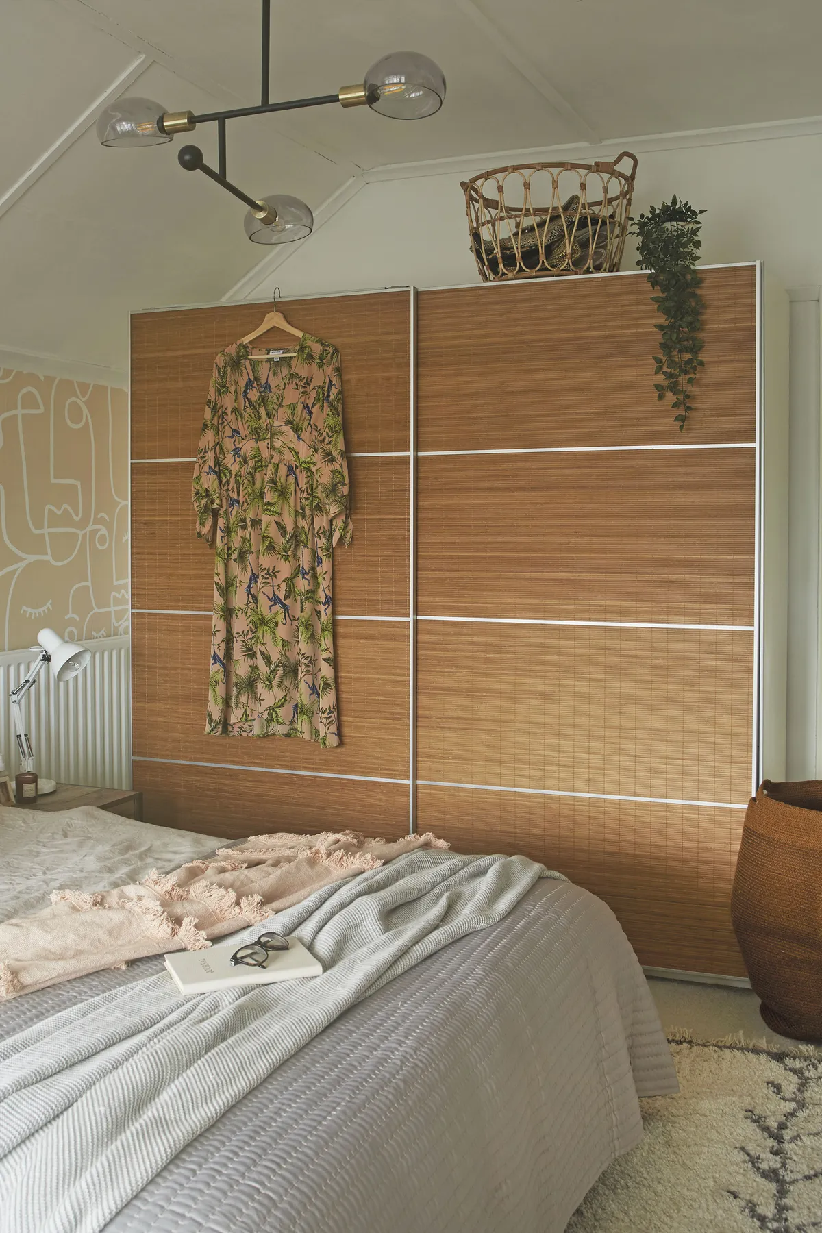 Ideally the couple would have liked to replace their old wardrobe with a built-in design, but it would have meant moving the radiator. Instead, they updated it with new bamboo panels from IKEA, which gave the wardrobe an entirely new look and helped keep costs down