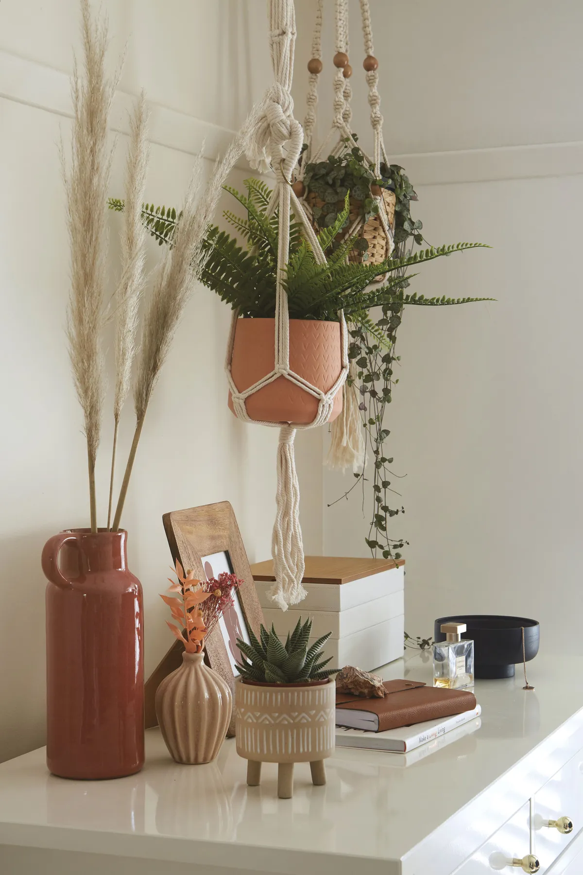'I love natural textures and I think some of the bits I’ve chosen – such as the fringed wall hanging, woven baskets and macramé plant hangers – add a relaxed boho touch' says Laurie