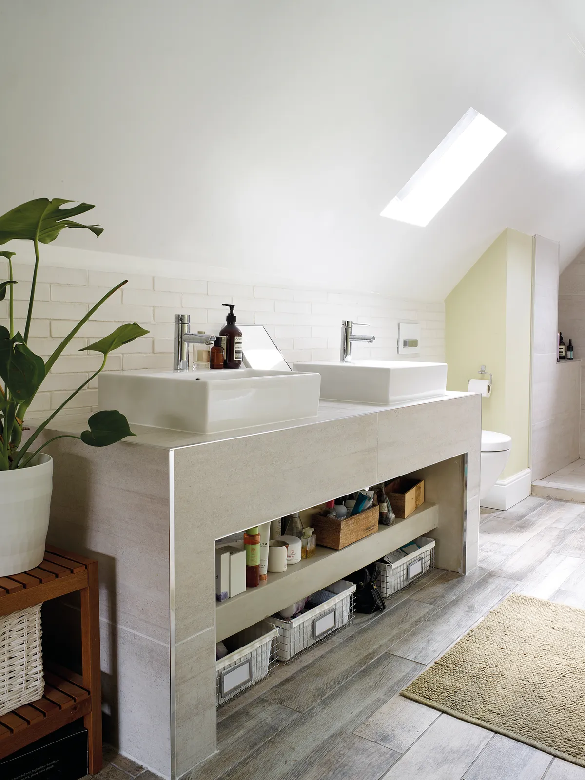 The Barcelona free-standing bath from Victoria   Albert Baths and the spacious walk-in shower screams luxury in the upstairs bathroom. Oak wood-effect tiles from Fired Earth and the Antheus wash basin by Villeroy & Boch finish off the luxe look