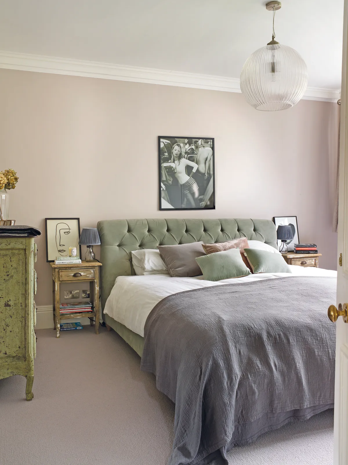 A pair of vintage bedside tables (£50 at a local antique market) sit either side of the sumptuous Dozer bed that’s dressed with velvet and linen cushions and a Nassau throw from Soho Home. Over the bed hangs a picture of Kate Moss by Mario Testino from East Urban Home at Wayfair