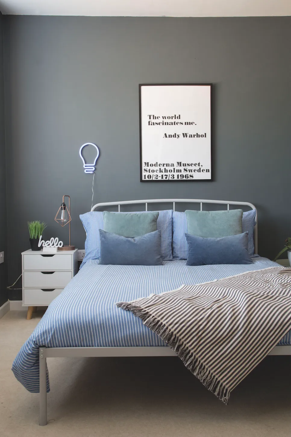 'We opted for a Valspar colour-match of Farrow & Ball’s Downpipe and kept the scheme smart and sophisticated with a metal double bed, IKEA bedding and an Andy Warhol print,' says Liz. See her home makeover.