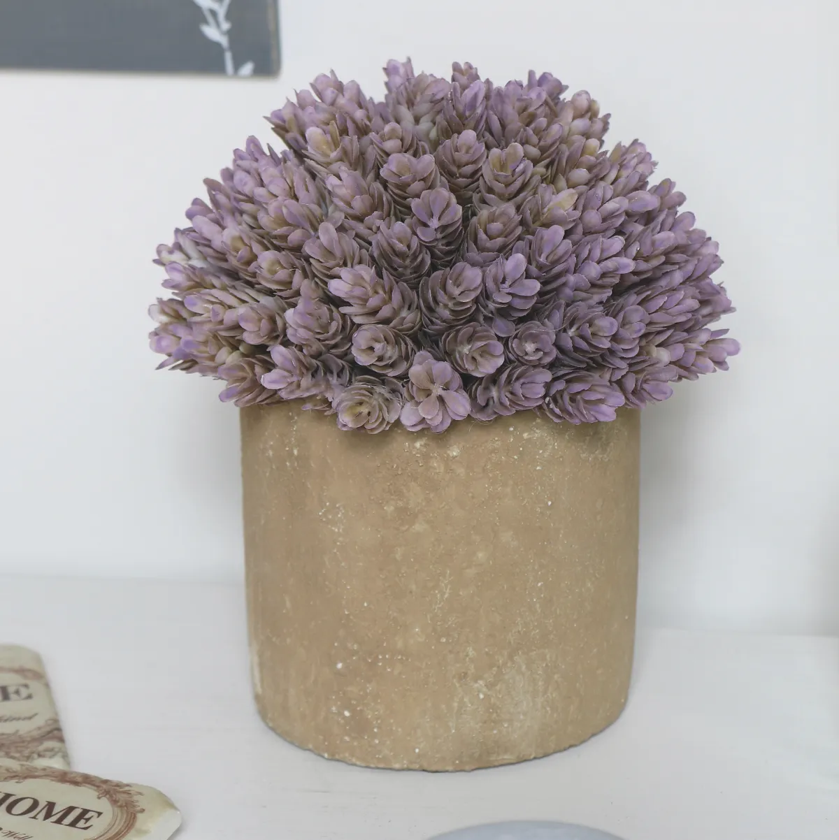 Purple succulent in stone pot, £21.95, Melody Maison