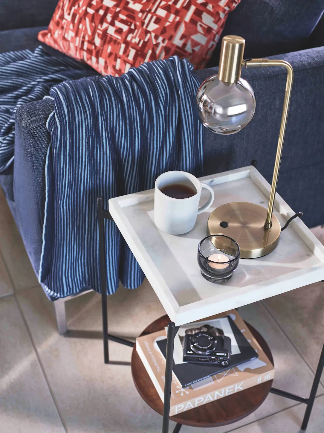 Belgrave medium two-seater sofa in Erin Midnight, £1,599; Design Project by John Lewis cushion in Burnt Orange, £60; Rib knit throw in Navy, £50; Rubin side table in Black, £199; Neo mug in Putty, £8; LSA International Utility tealight holder, £25 for a set of two; Huxley task lamp in Smoke/Antique Brass, £70; Canon PowerShot G7 X Mark II digital camera, £529.99, all John Lewis & Partners