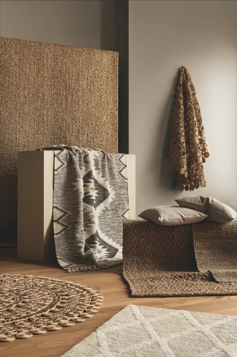 Use tactile floor textures such as woven wool and natural-coloured jute to bring cosiness and comfort to this simple scheme. Rugs, from £39.99; cushion covers, £3.99, both H&M