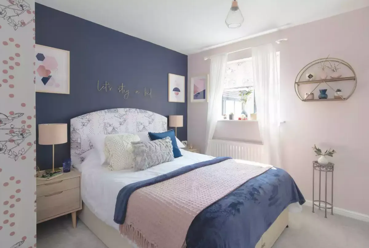 ‘I was drawn to using the navy and blush combination for our bedroom scheme,' says Laura