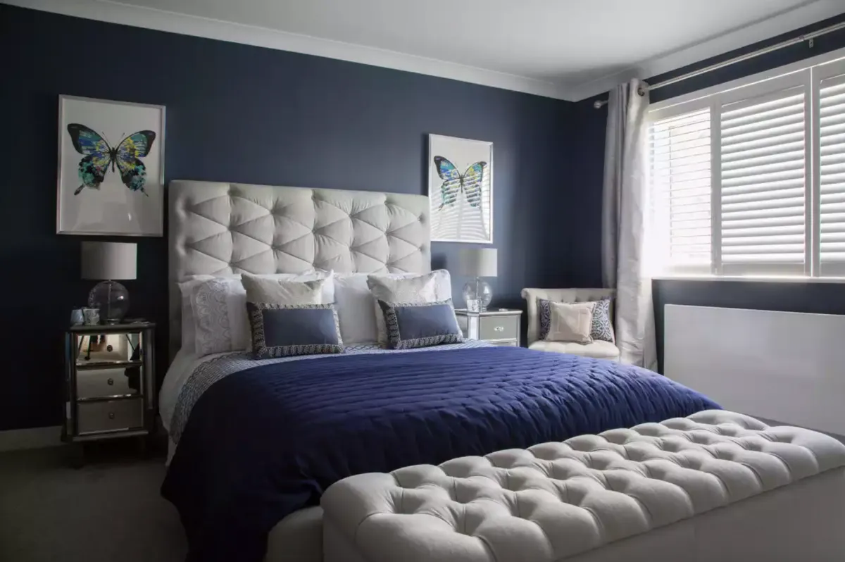 Faye kept a neutral palette in the rest of the house, but used dark, plush blues for her luxurious master bedroom. See her home makeover.