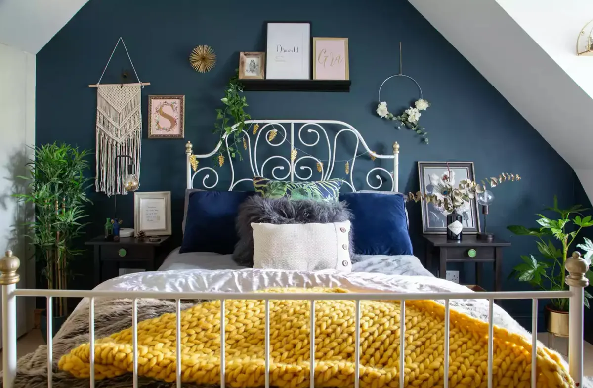‘I’m always drawn to dark colours as I think they make a room feel so cosy, which was particularly important in the bedroom, so we chose a beautiful deep blue-green hue for two of the walls. See her home makeover.