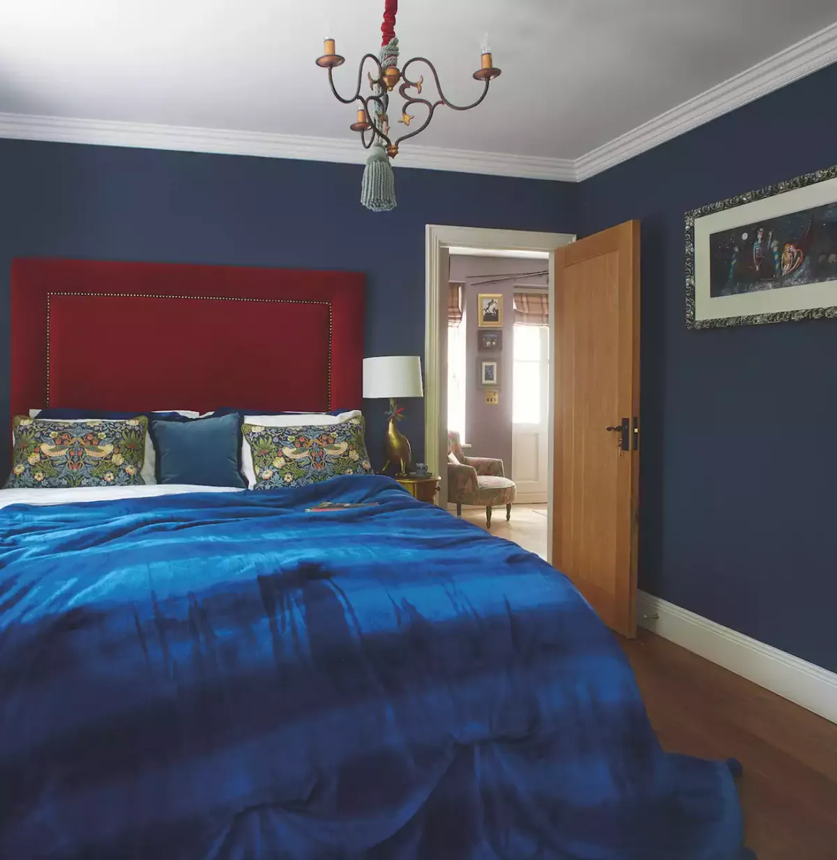 Haley and Eugene painted their bedroom walls in Zoffany’s Como Blue. See their home makeover.