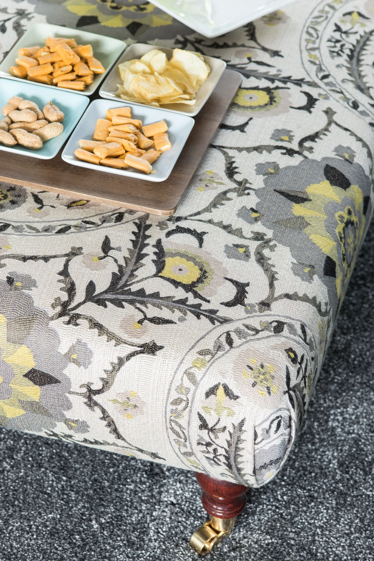 Good idea! Make more of a footstool by turning it into a small table for drinks and snacks – cover it in a fabric that matches the colour scheme to help tie it in with the rest of the décor
