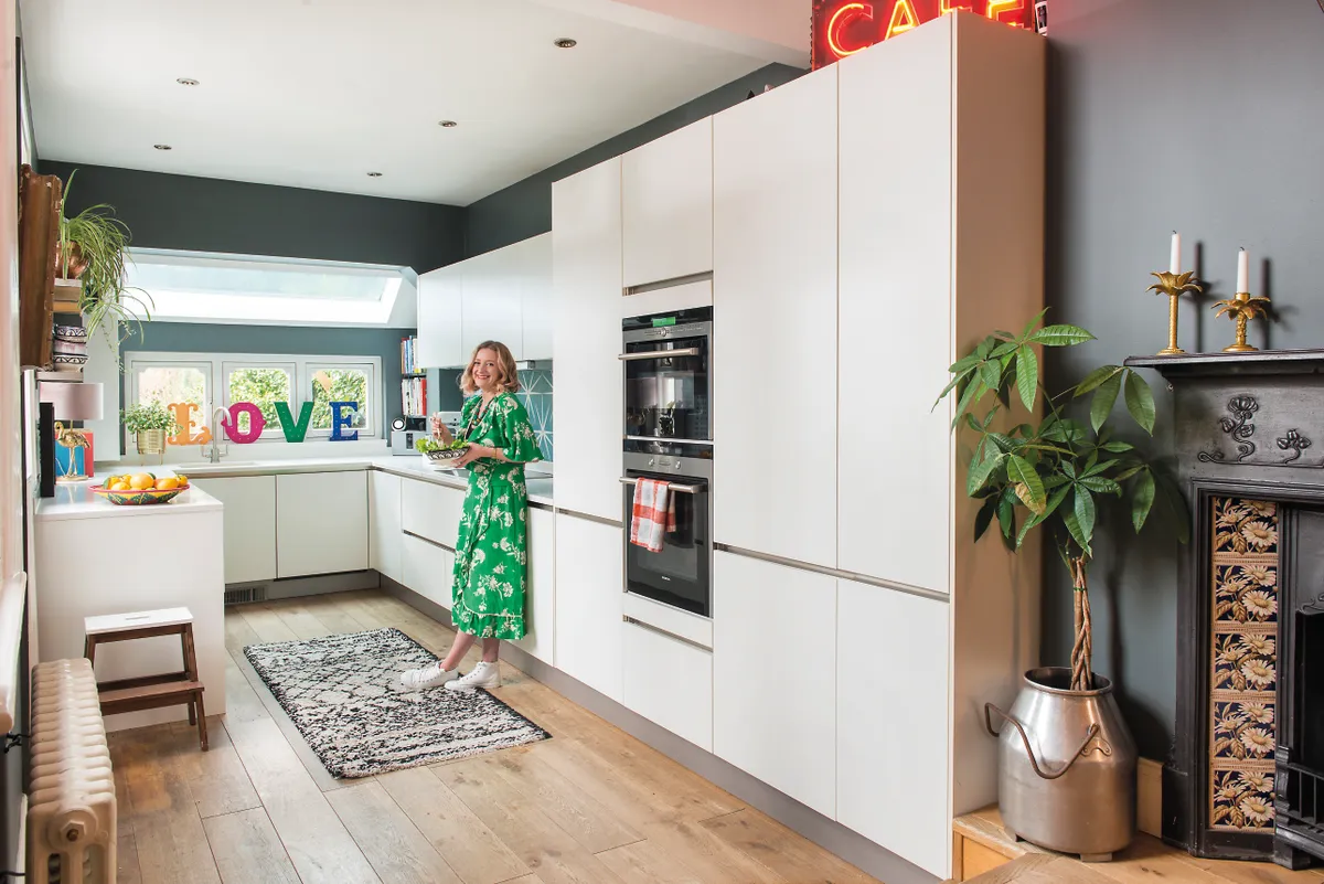 The previous owners had installed a simple white-gloss kitchen that included integrated appliances and high-quality quartz work surfaces. As well as tiling and painting the walls, Sophie and Rich added open shelves to boost storage and display treasures
