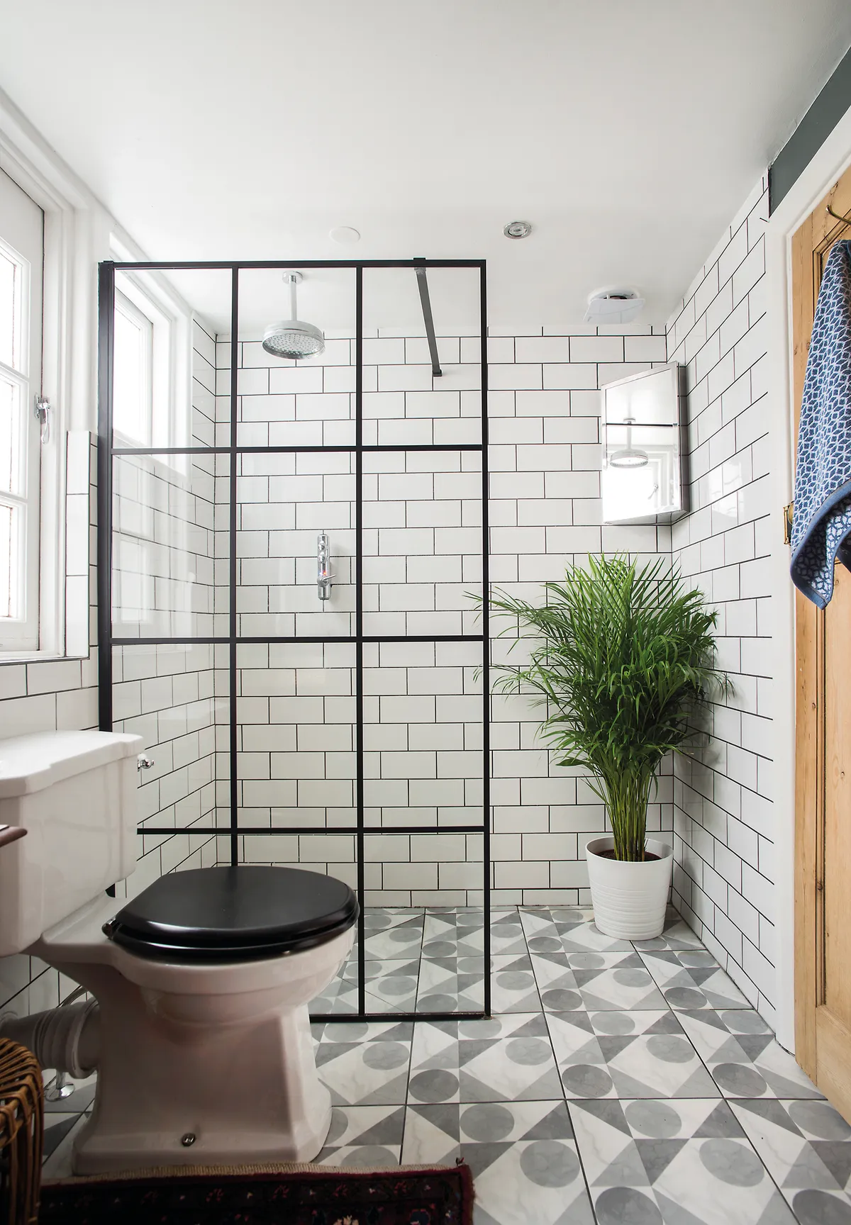 ‘I knew I wanted white metro wall tiles, with dark grey grout for impact. The black Crittall-look shower screen was another must-have as it picks up the rectangular pattern. I rescued the nifty corner cabinet from the recycling centre’