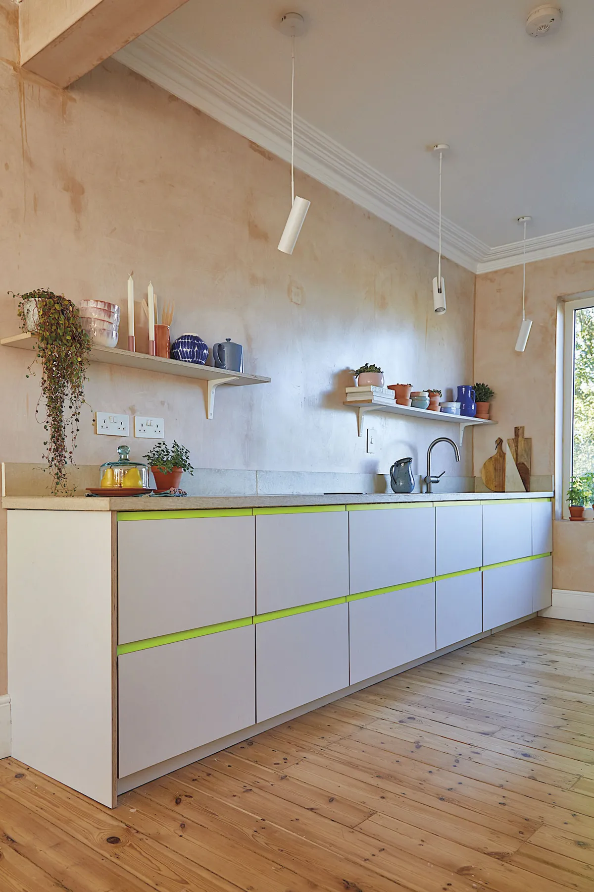 In the kitchen and throughout her home, Shrez has installed shelves which gives the illusion of more space