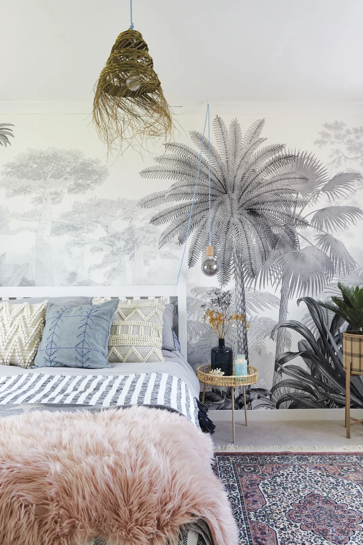 Ellie chose this striking wallpaper mural from Photowall to create an eye-catching focal point in this room. Textured cushions and throws add a tactile element