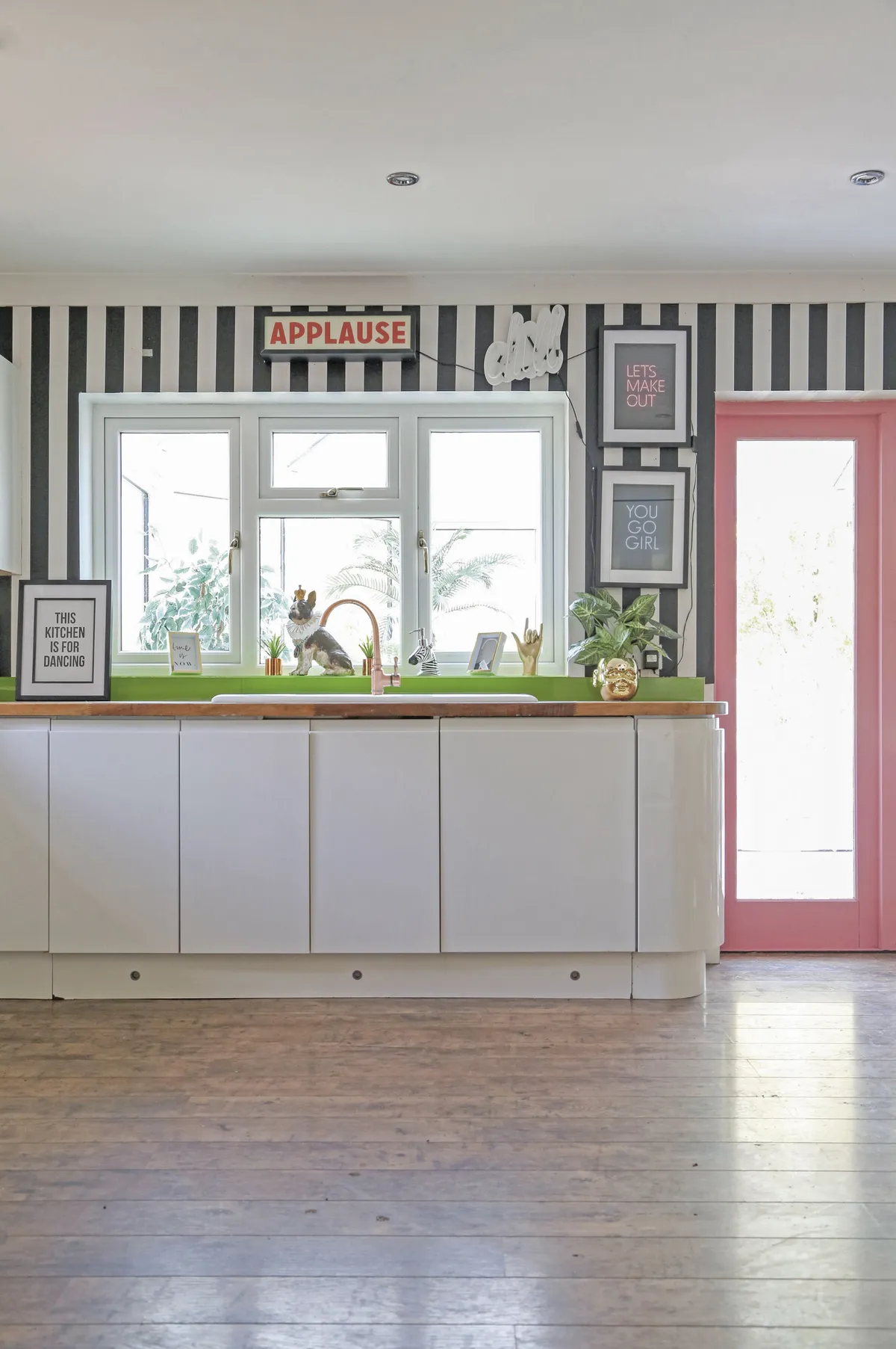 ‘We had a new kitchen fitted by Magnet, and new French doors leading into the conservatory,’ Hayley explains. ‘Now, it’s so much more spacious and streamlined.’ Not one to miss an opportunity for bold colour, Hayley went for a door frame in a bubblegum pink
