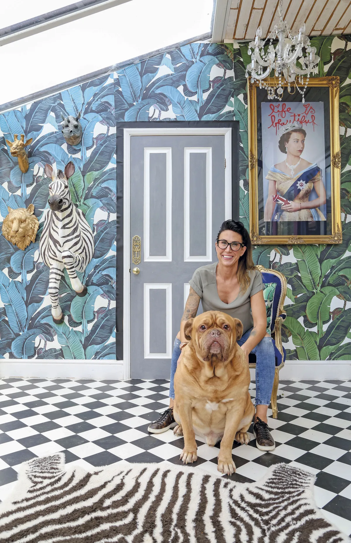‘The banana leaf wallpaper was bought from a seller on Etsy called Wallpapers 4 Beginners. The amazing print of the Queen is by Mr Brainwash. I framed it and gave it pride of place alongside my favourite piece: the zebra,’ Hayley says