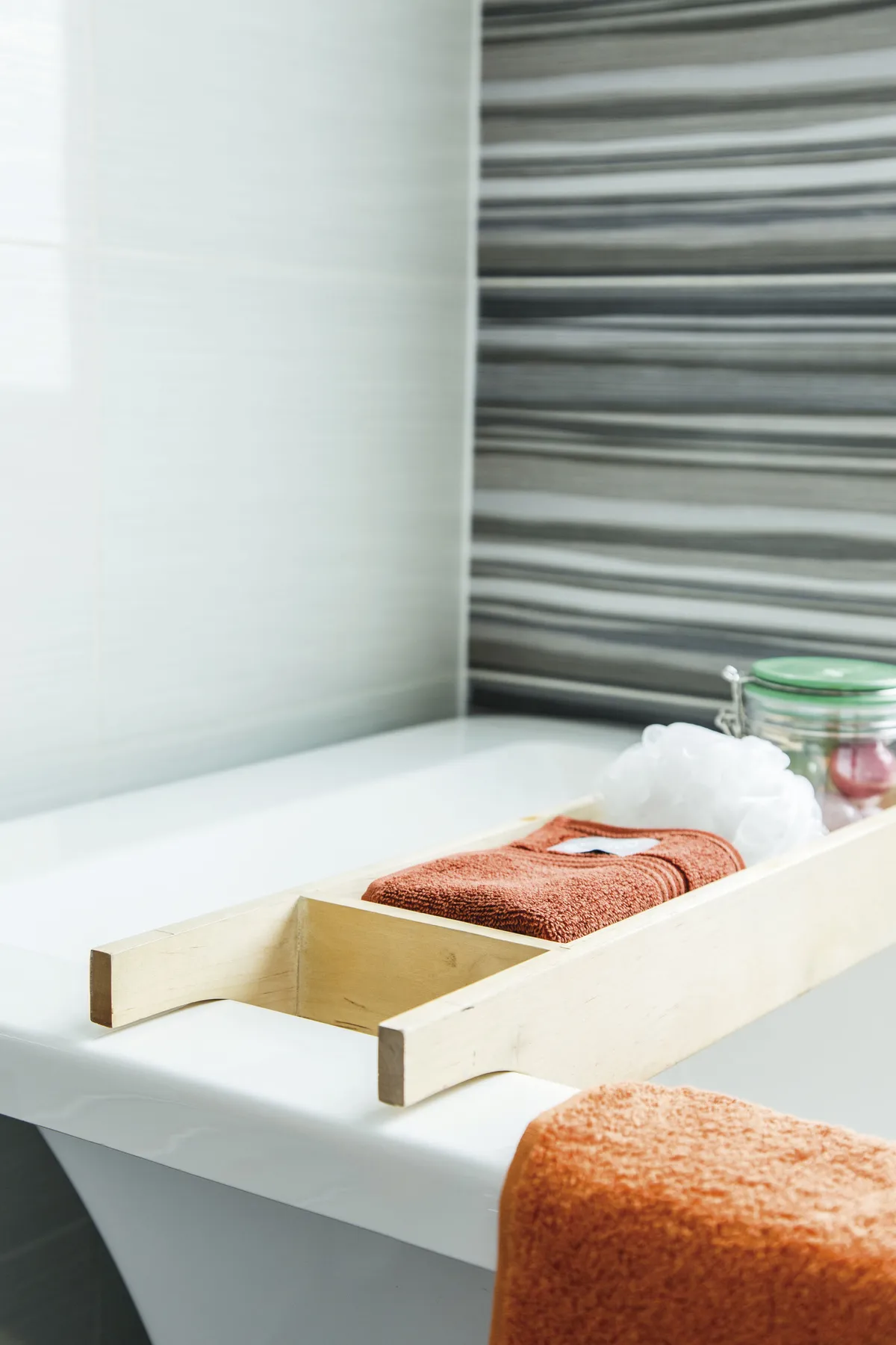 A simple bath rack in blond wood adds practical storage to the bathroom and is perfect for holding some of Teresa’s more decorative accessories
