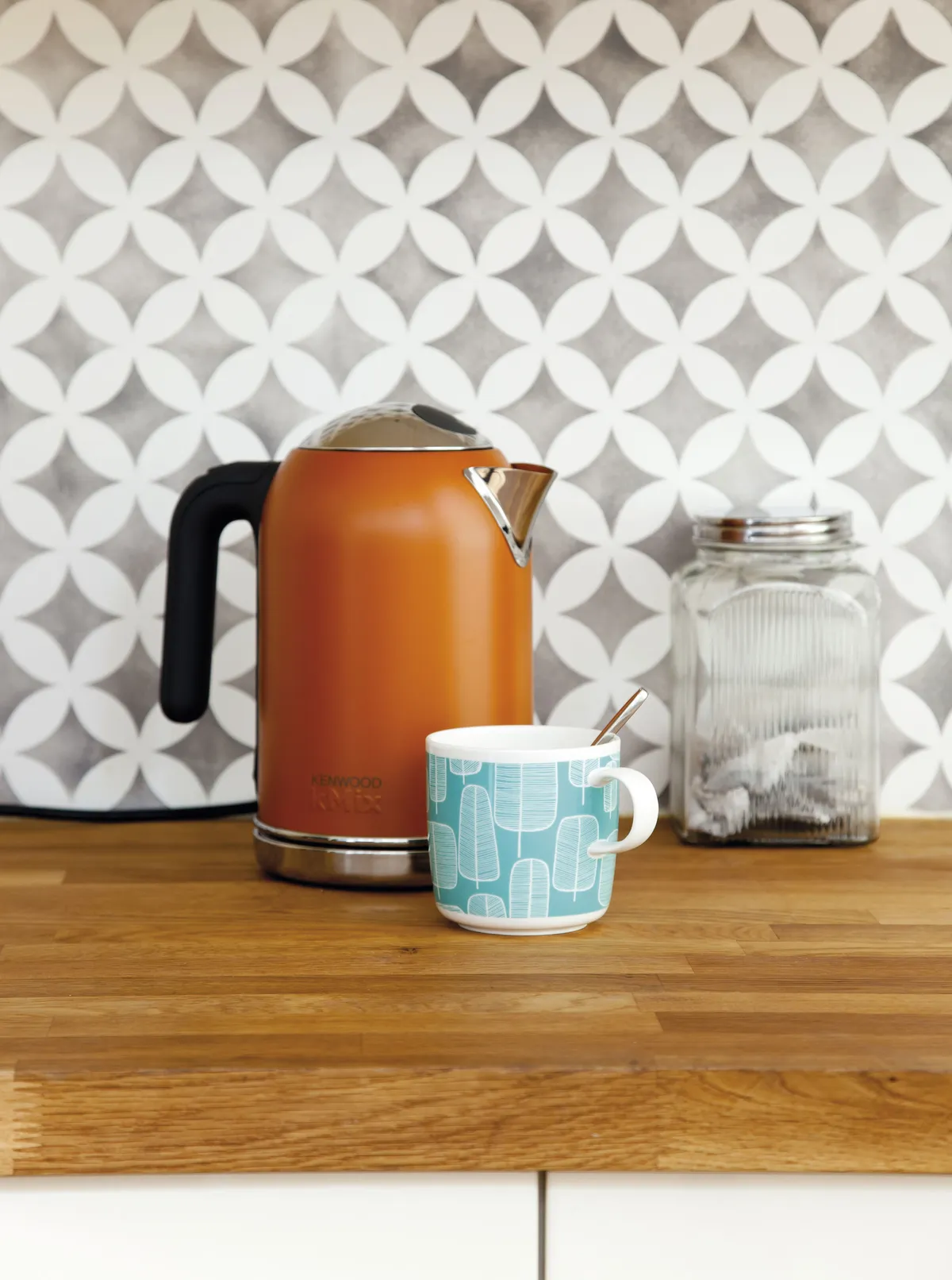 It cost just £42 to stencil a pattern that looks like tiles. Make sure you use wipeable kitchen paint so the walls are protected, and the design will last