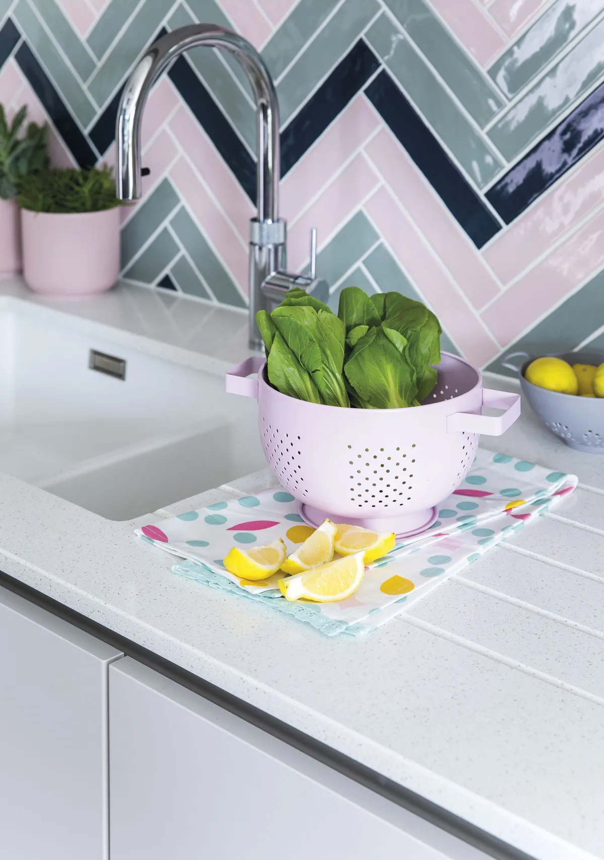 Rebecca designed this colourful herringbone splashback, which makes a stunning focal point and echoes the pattern on the floor