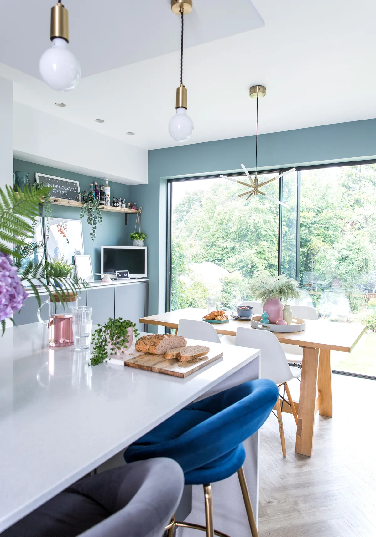 Good idea! Choose different coloured doors to add interest to a simplistic kitchen design