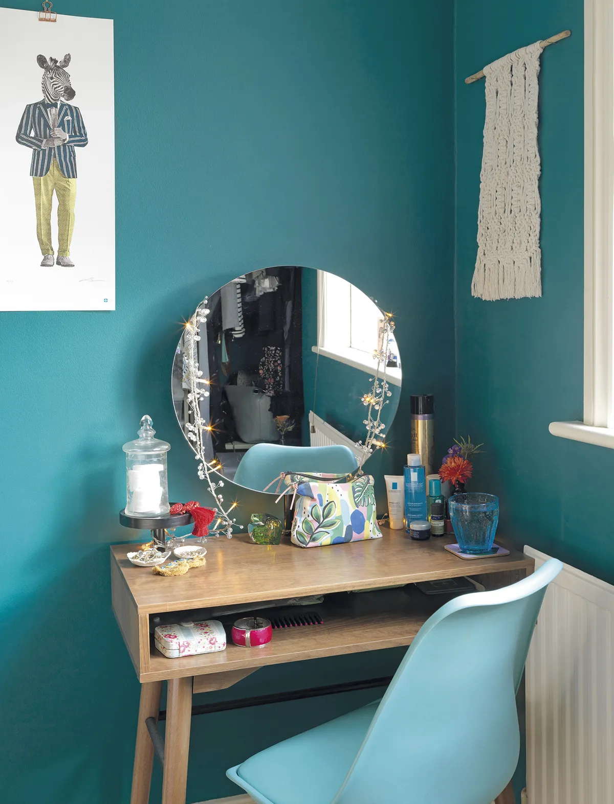 ‘I recently got rid of my shabby chic dressing table and bought this modern alternative. I think the dark wood sits perfectly with the green walls.’ Emily bought the zebra print by Kerry Eggleton from a local art fair. ‘It was a second, so I got a real bargain’