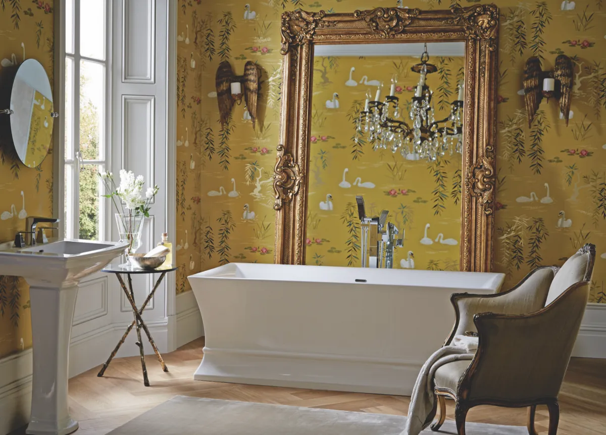 Adorn walls with a dramatic wallcovering and layer on the character with architrave and grand chandelier, perfect for the Penrose freestanding bath, £1,600; Blenheim basin, £275; and pedestal, £150, all Heritage Bathrooms