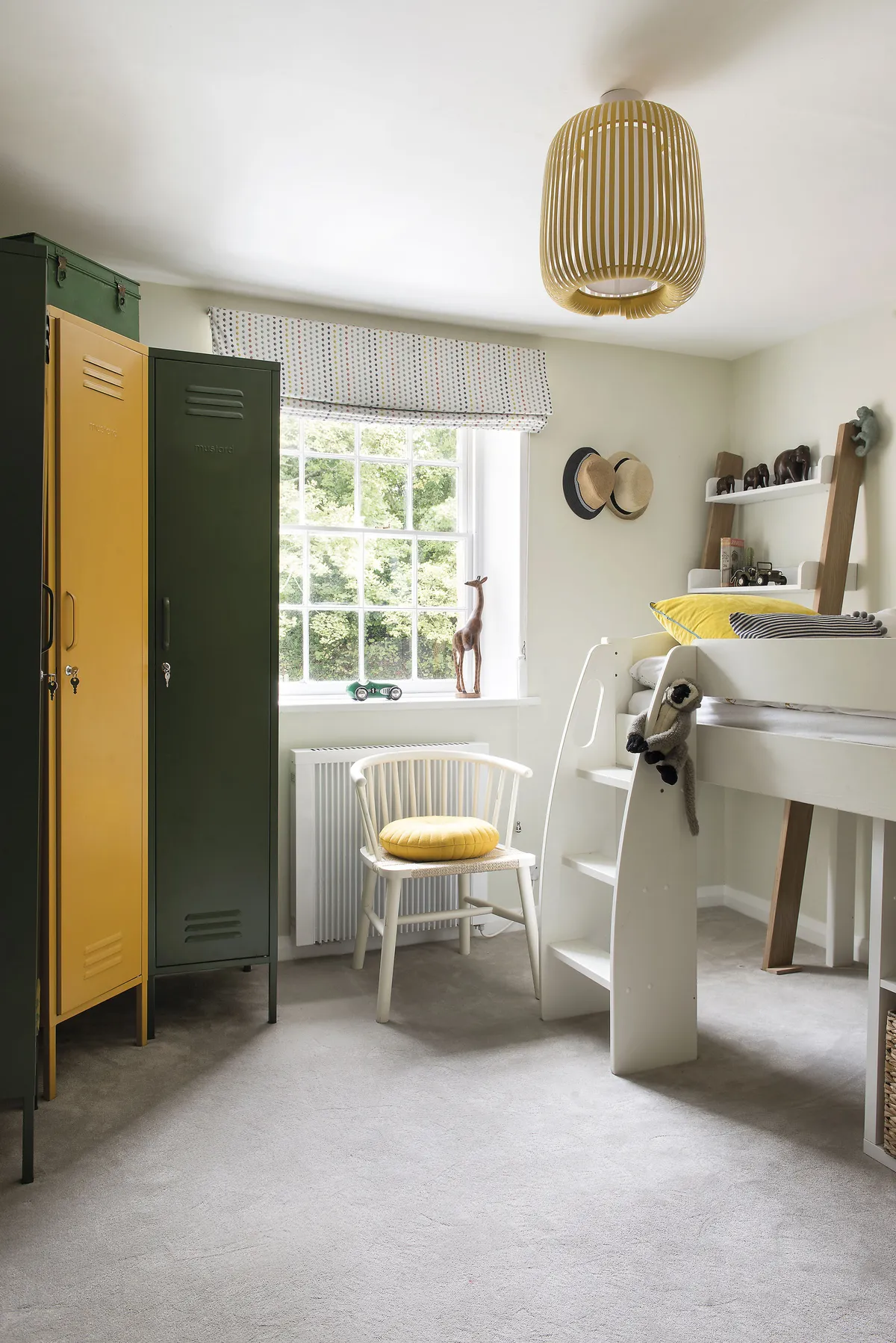 Funky metal lockers in autumn tones by Mustard, found at Wild Flora, solved the storage issue in William’s bedroom and a Ladder Office Desk by Argos matches the contemporary bunk bed