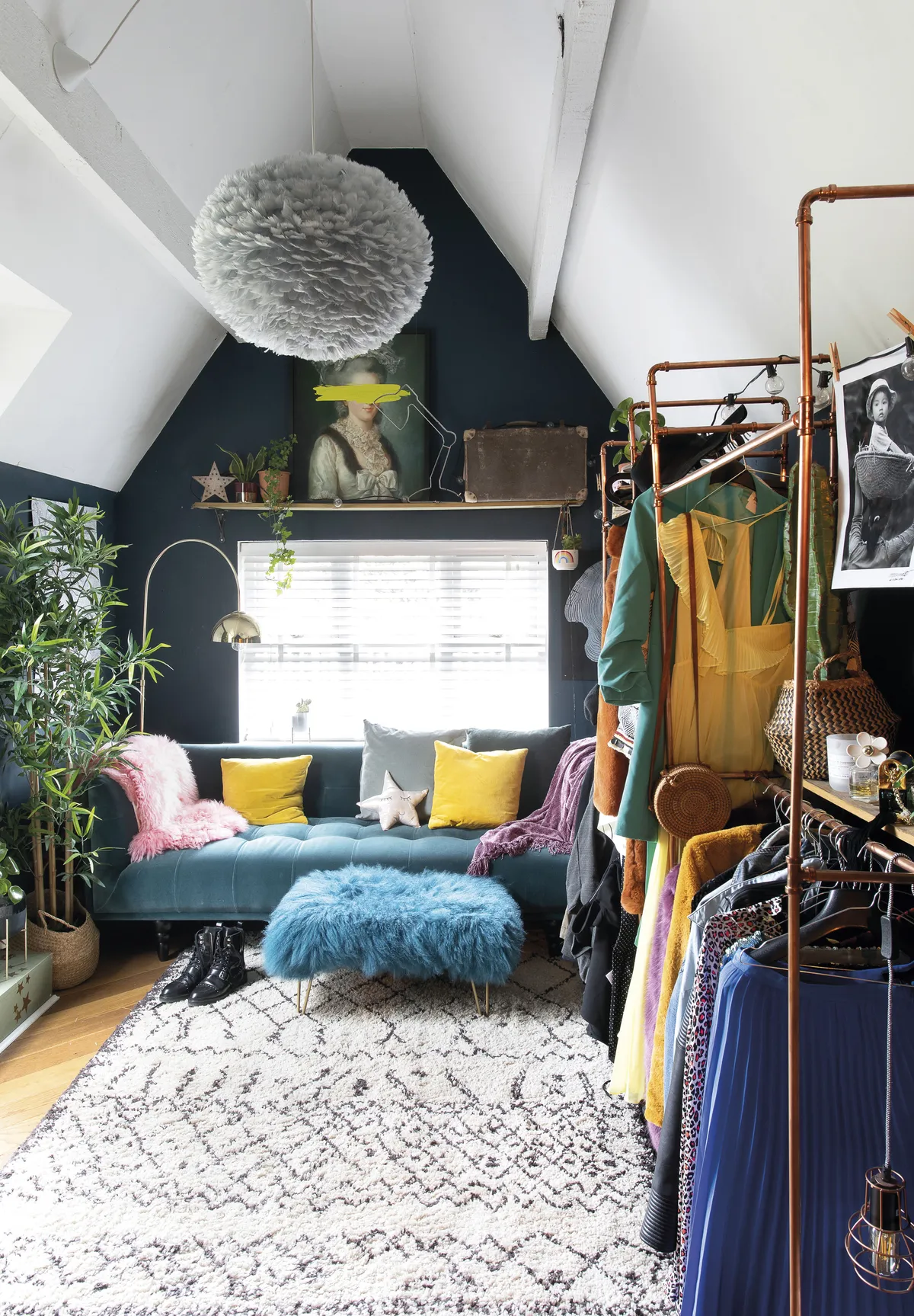 ‘Michael made the hanging rail from copper piping. I got the idea from Pinterest,’ Eniko shares. The walls are painted in Hague Blue by Farrow & Ball, and the teal sofa is from MADE, brightened up with accessories in rainbow hues
