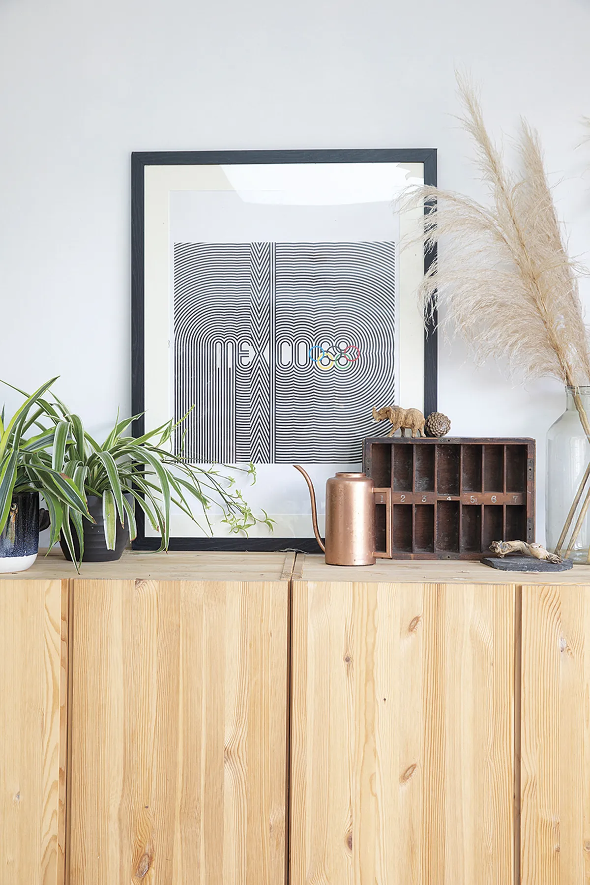 ‘We fixed these IKEA Ivar cabinets together to made them look like one sideboard,’ says Sam. ‘Hanging them on the wall makes them easier to clean and they hide all the kids’ toys’