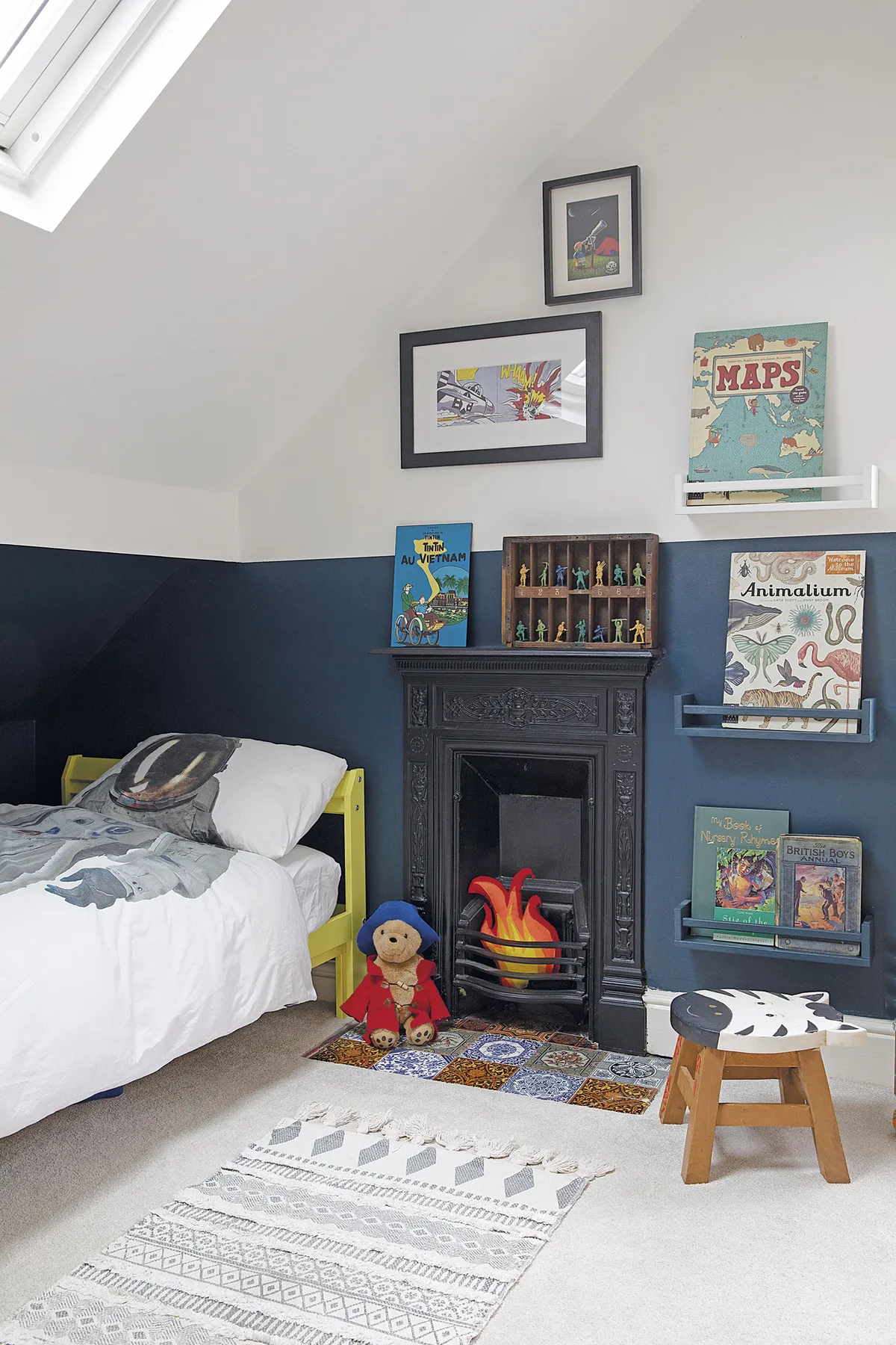 Sam turned IKEA spice racks into bookshelves and painted the bed frame in Yellowcake by Farrow & Ball. ’The printer’s tray was bought at a vintage market,’ says Sam. ‘It’s great for displaying Barnaby’s toy soldiers’