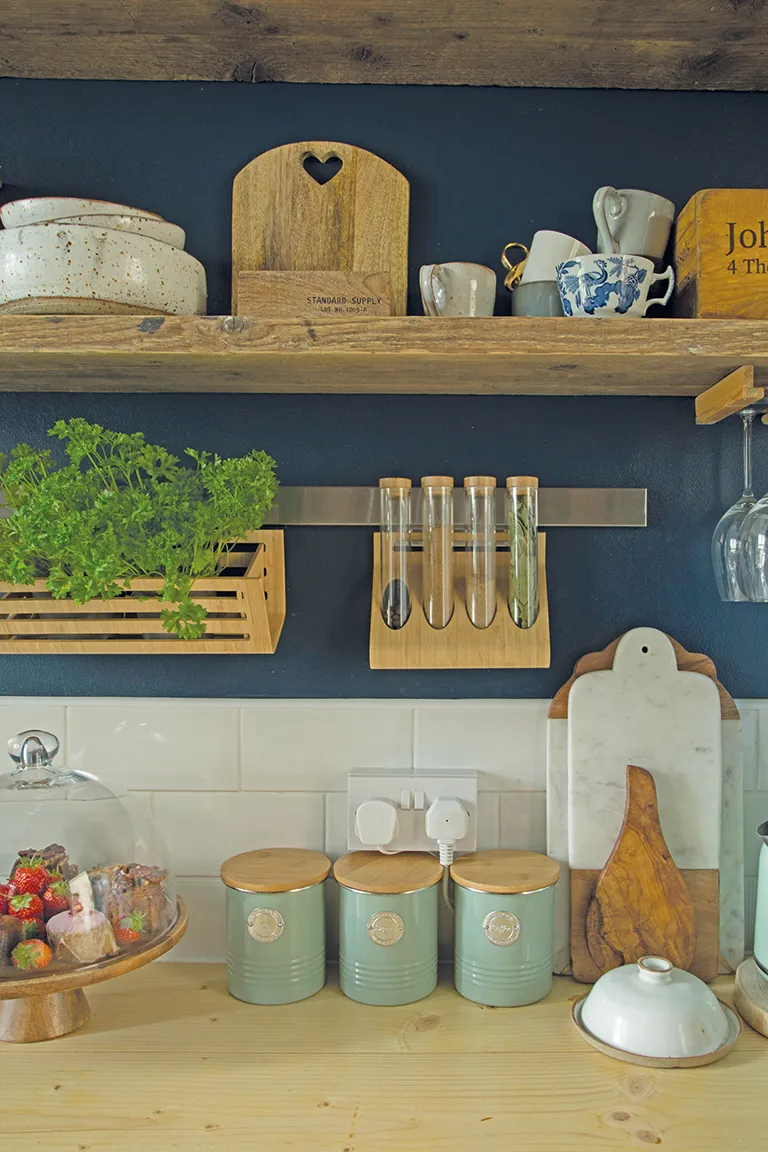 The shelves, which we made from old scaffolding boards, are one of my favourite features in the flat,’ Tosia says. ‘They’re home to my handmade dining sets from Christina Gascoigne, a small pottery studio in Richmond, and an old wooden tea box that dates back to 1930, which I found at a car boot.’