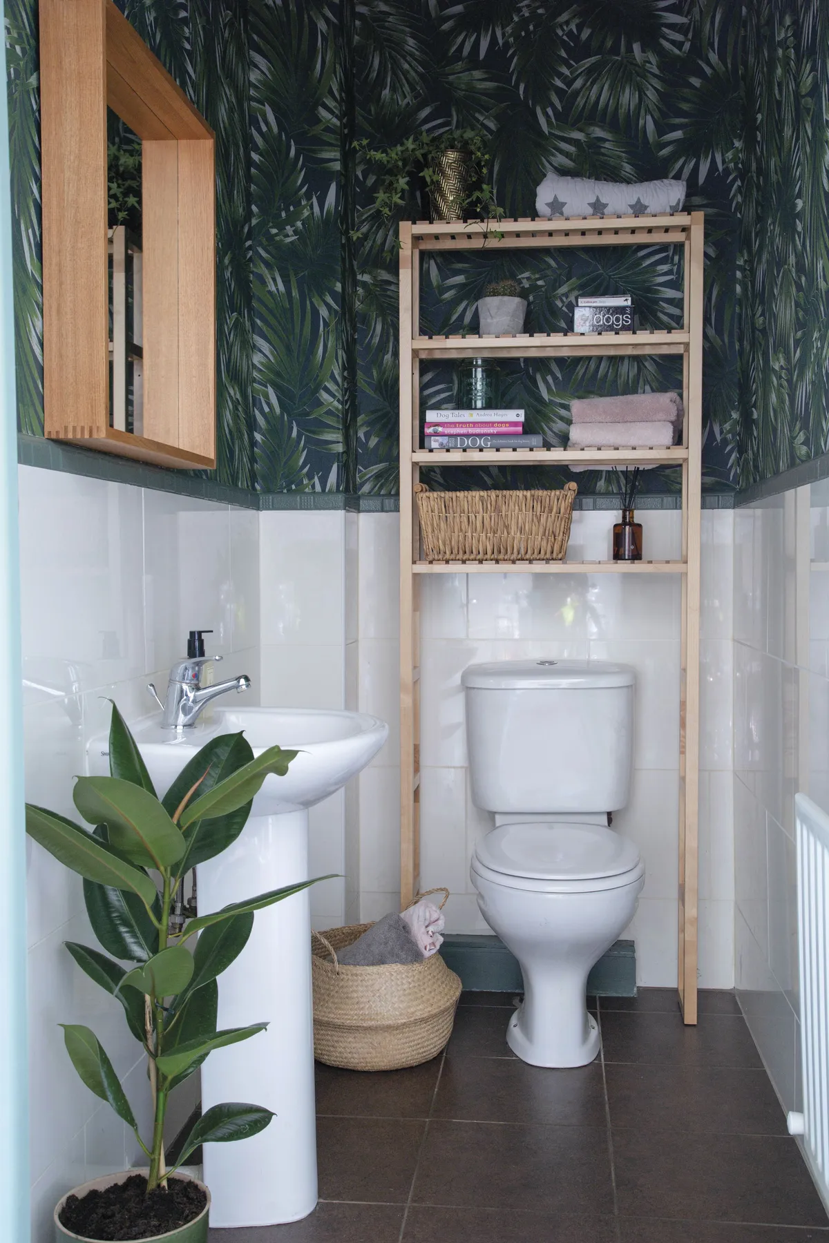 ‘The tiles were original and definitely wouldn’t have been my first choice,’ Elaine reveals. ‘I added the palm print wallpaper and wooden wares in an attempt to tone down the harshness.’